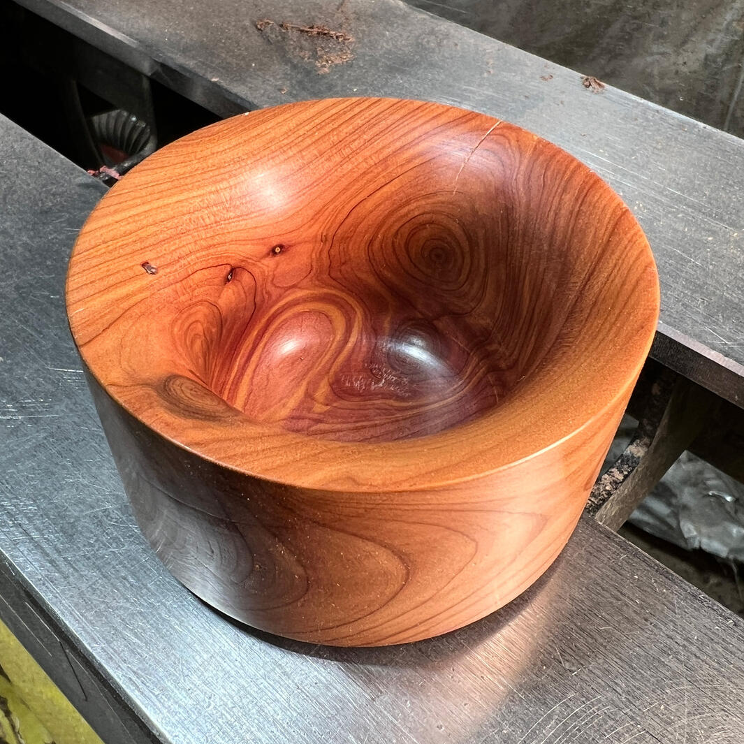 Cedar cup sitting on lathe